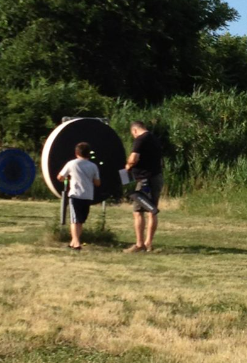 Noah and Jim collecting arrows from target.